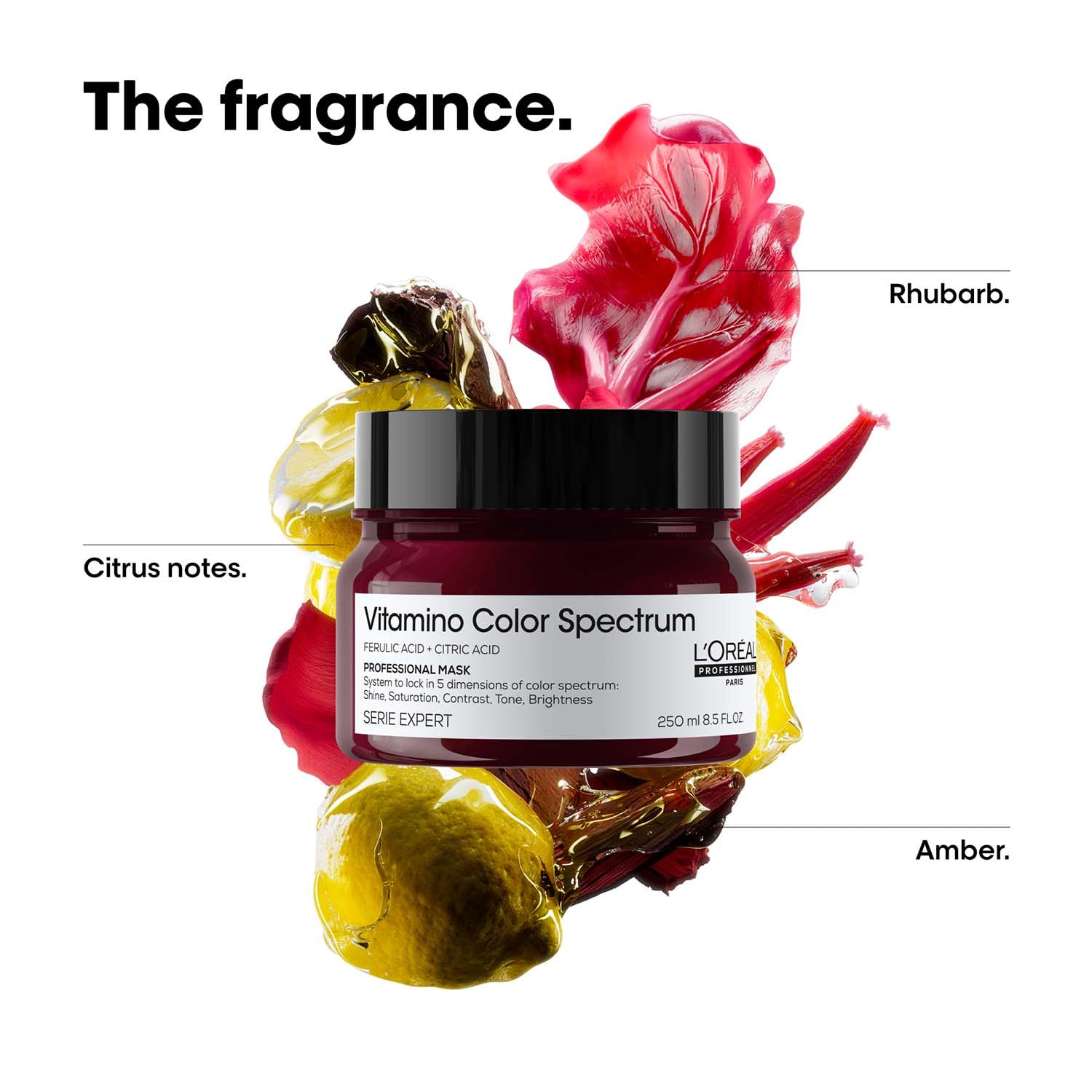 L'Oreal Vitamino Color Spectrum hair product with colorful leaves and flowers on a white background